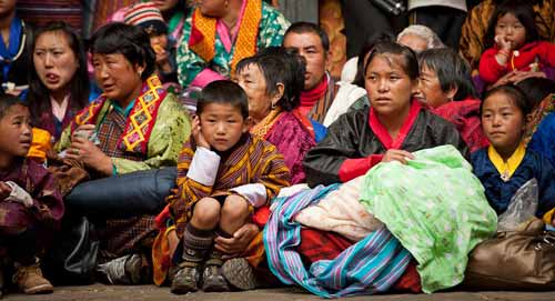 Bhutanese looking at dancing monks FT3.